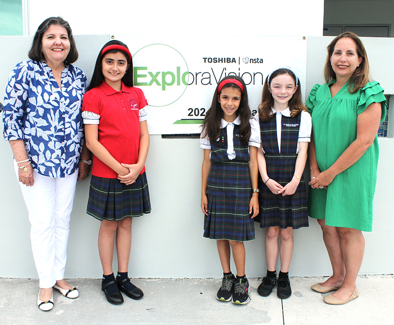 St. Thomas the Apostle School staffers Carmen Garcia, left, and Ana King, right, flank third graders Isabella Gustin, second from left, Emilia Martinez Christensen and Adriana Icaza, the team who created “The Allergen Detector” project that won first place in the 2024 Toshiba/NSTA ExploraVision Science Competition in the kindergarten through third grade division. (CRISTINA
CABRERA JARRO | FC)