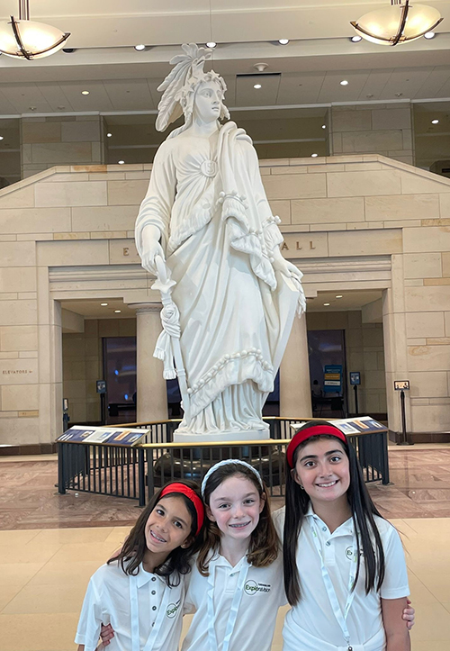 From left: Emilia Martinez Christensen, Adriana Icaza, and Isabella Gustin of St. Thomas the Apostle School in Miami enjoy sightseeing during their Washington, D.C. trip, June 13-14, 2024, including this stop to the visitor center of the U.S. Capitol Building featuring the Statue of Freedom behind them. The trip was one of the prizes for winning the Toshiba/NSTA ExploraVision Science Competition.