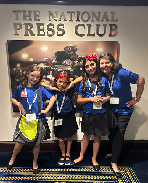 From left: third graders from St. Thomas the Apostle School in Miami, Adriana Icaza, Emilia Martinez Christensen, Isabella Gustin, and teacher Carmen Garcia, pose on June 14, 2024, after the media presentation of their invention, the Allergen Detector. The idea won first place in the kindergarten through third grade division of this year's Toshiba/NSTA ExploraVision Science Competition, which included a trip to Washington, D.C.