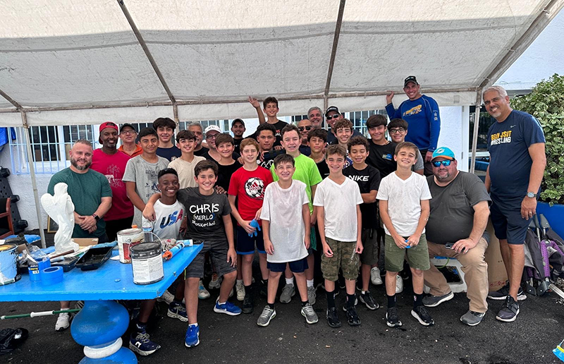 Members of the Father and Son Apostolate of Agrupación Católica Universitaria, along with their sons in grades 6-12, participate in service projects, Catholic faith activities, and skills development, such as helping with the upkeep of the Missionaries of Charity house in Miami.