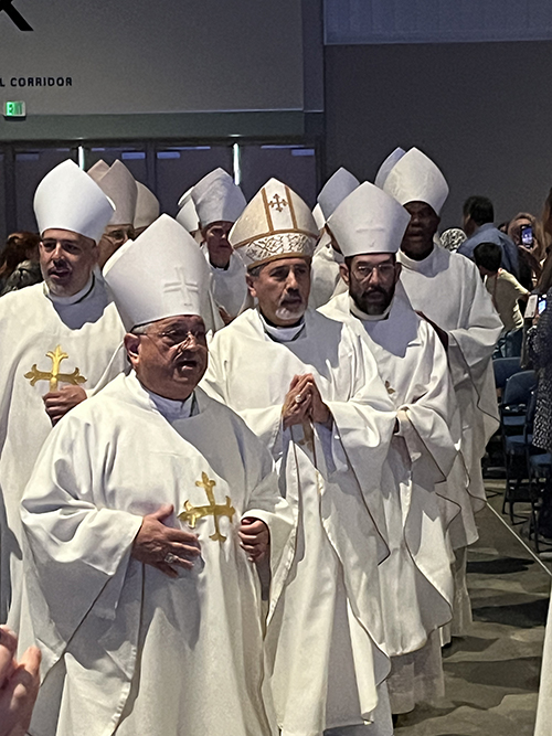 Miami Auxiliary Bishop Enrique Delgado and other Miami priests process at the Spanish Mass at the National Eucharistic Congress July 20, 2024. The National Eucharistic Congress was held July 17-21, 2024, in Indianapolis, Indiana.