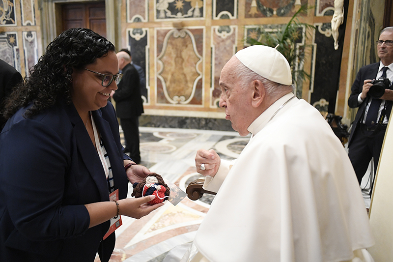 Isabelle Seiglie presents Pope Francis with a crocheted version of Our Lady Undoer of Knots during the International Congress on Ministry with Young People May 23-25, 2024.