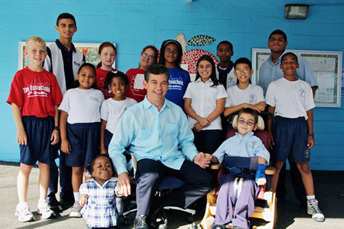 Principal Eddy Garcia sits with some of his students from Immaculate Conception School in Hialeah, where he taught for 14 years. He later taught at St. Louis Covenant School in Pinecrest for 11 years, where he retired from in June 2024.