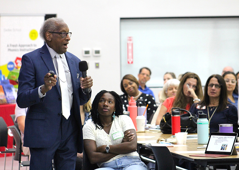 New teachers listen as Donald Edwards, associate superintendent of schools for the Archdiocese of Miami, leads a session on relationships between teachers and parents and students. Mora than 240 new teachers gathered at Monsignor Edward Pace High School in Miami Gardens Aug. 5, 2024 for orientation.