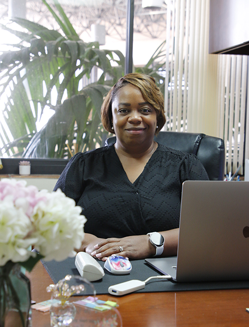 LaTonya White sits at her desk in the Office of Catholic Schools in the Pastoral Center of the Archdiocese of Miami. White is the associate superintendent of teaching and learning, and began in her position July 1, 2024.