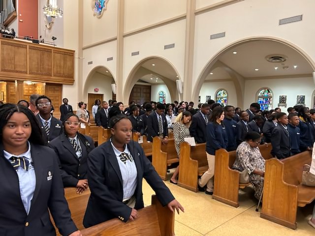 Students from Cristo Rey High School in North Miami listen to Archbishop Thomas Wenski's homily at the opening of the school year Mass Sept. 3, 2024, at St. Mary's Cathedral in Miami.