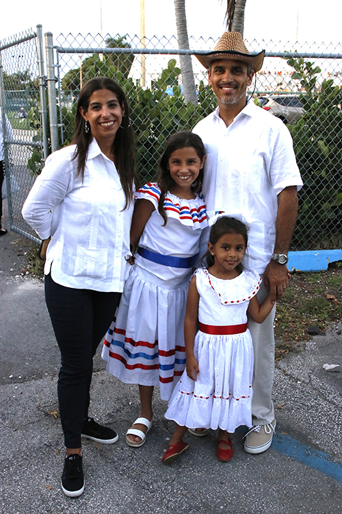 Teresita Núñez Pérez and Erick Pérez, presidents of the Archconfraternity of Our Lady of Charity in Miami, pose with their daughters Sophia and Liliana, before this year's Mass celebration, which took place at Milander Park in Hialeah Sept. 7, 2024.