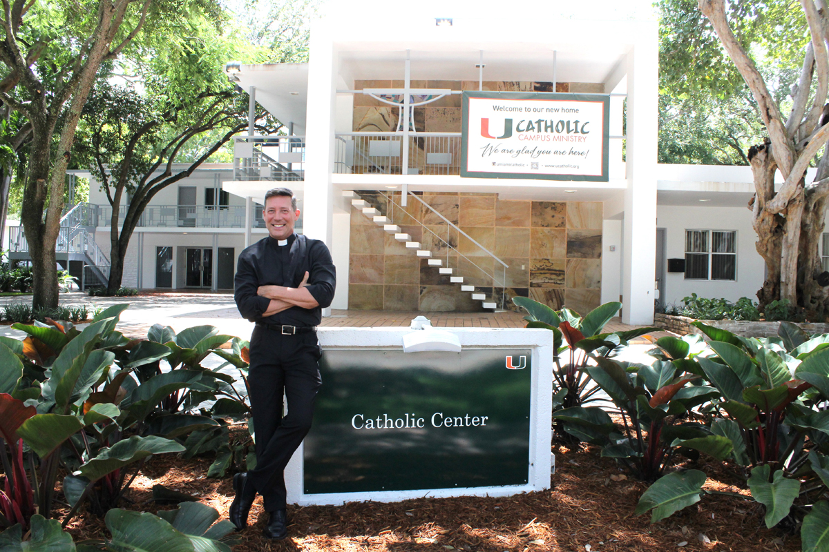 Father Richard Vigoa, pastor of St. Augustine Parish in Coral Gables, stands outside of the newly relocated and renovated Catholic Center on the University of Miami campus in Coral Gables.