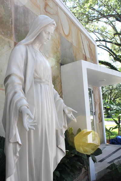 A statue of the Virgin Mary stands outside of the newly relocated Catholic Center in the University of Miami campus.