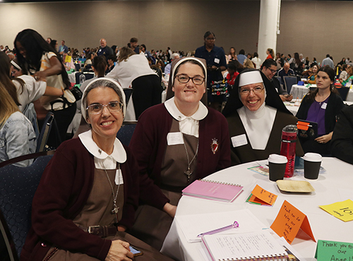 Servants of the Pierced Hearts of Jesus and Mary, Sister Michelle Fernandez, a religion teacher, left, and Sister Rose Marie Koos, involved in campus ministry, both from Little Flower School in Hollywood, pose for a picture with Sister Mary Louise Marck, a religion teacher at Archbishop Coleman Carroll High School in Miami. They were among more than 2,000 teachers who attended the Catholic Schools Professional Development Day, held Sept. 27, 2024 at the Broward Convention Center in Fort Lauderdale.