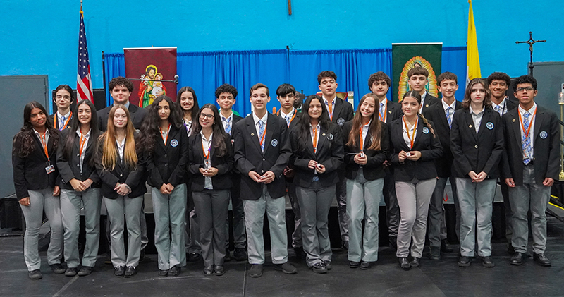 Twenty-one sophomores at Archbishop Coleman Carroll High School became the first group to be inducted into the St. Michael's Scholars Program at a ceremony held in the school's gymnasium Oct. 24, 2024. These students will graduate with both an associate's degree and a high school diploma.