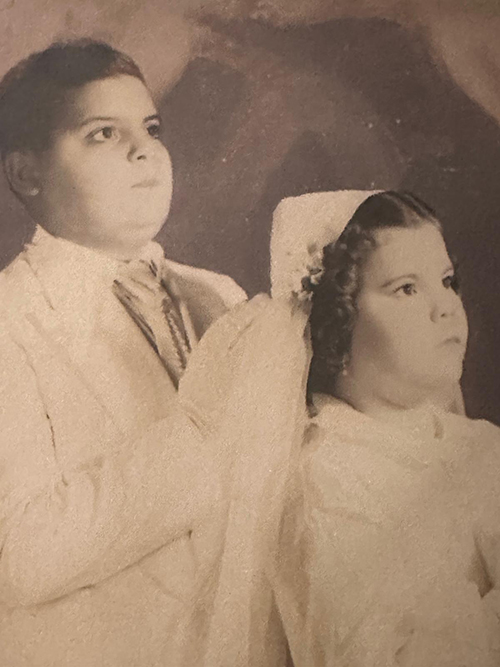 A young Sister Olga Gomez is photographed for her First Communion, along with her brother Jose Ramon "Mongui" Gomez. Sister Olga, a Cuban-born Daughter of Charity of St. Vincent de Paul who served in Cuba, Puerto Rico, and Miami, died Nov. 8, 2024. She was 77.