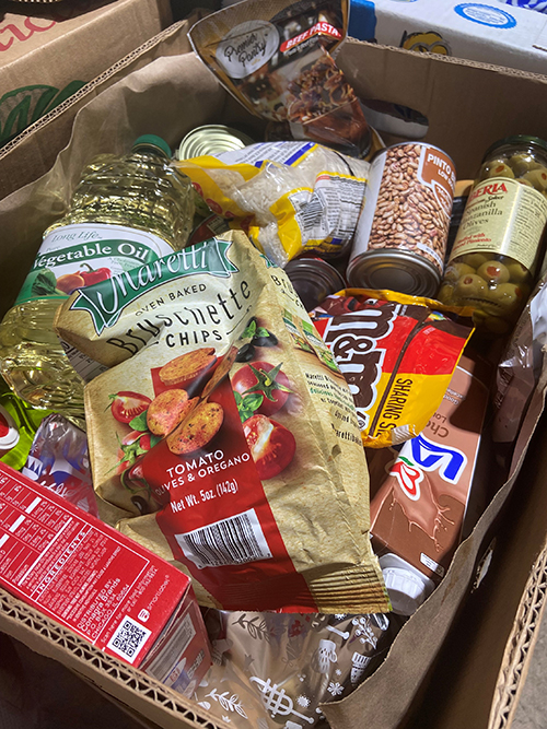 A view of the boxes packed and distributed at Catholic Charities Matthew 25 Food Pantry in Miami shows a variety of food items. More than 1,500 households receive boxes like this one on the first and third Saturdays of the month, and on a weekly basis as needed.