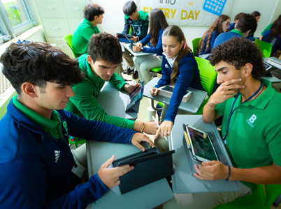 St. Brendan High students assist one another in solving problems with the use of their Apple devices. St. Brendan High was named an Apple Distinguished School in August 2024 for their innovation, leadership and educational excellence. They join five other Archdiocese of Miami Catholic Schools that hold the distinction.