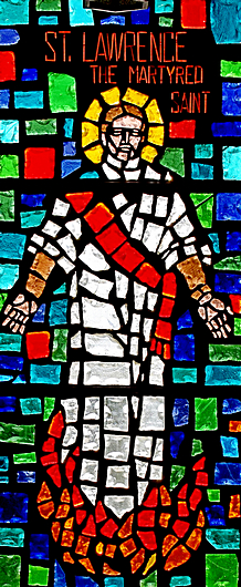 St. Lawrence stands defiantly amid the flames in this window at his church in North Miami Beach.