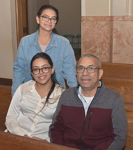 William Josepha brought his wife and daughter to the Jubilee Mass Dec. 28, 2024, at St. Mary Cathedral in Miami. Seated are Josepha and daughter Mariana; standing is wife Luz.