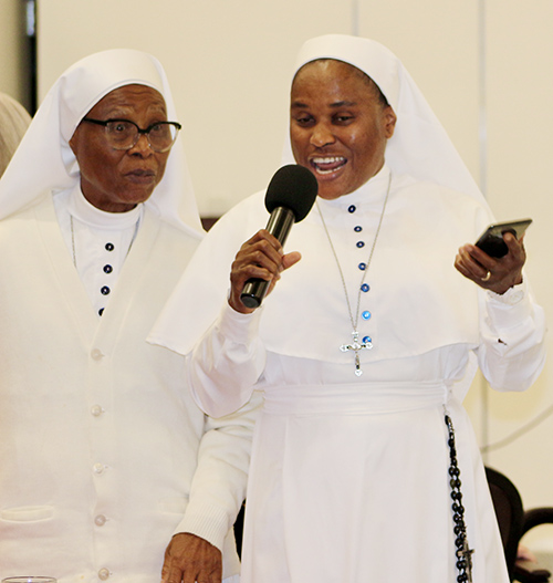 The Daughters of Mary Mother of Mercy sing “Gloria in excelsis Deo” in the Niger-Congo language Igbo during the Serra Club of Miami’s Christmas Dinner for Religious on Sunday, Dec. 8, 2024, at St. John Vianney College Seminary. The annual event, hosted by the Serra Club lay organization for vocations, celebrates local religious from around South Florida.