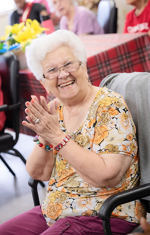 Seniors at the Wilton Manors Adult Day Care Center/Catholic Charities of the Archdiocese of Miami enjoy Christmas carols and other holiday music on Dec. 11, 2024, sung by students of Cardinal Gibbons High School in Fort Lauderdale.