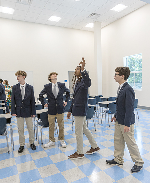 Students at St. Mary Star of the Sea Basilica High School in Key West enter the newly renovated high school building. The new facility will allow for full enrollment of all four grades in 2025 and was dedicated by Archbishop Thomas Wenski on December 13, 2024.