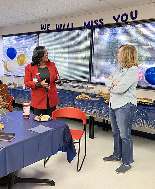 Carol Hylton, left, executive director of Catholic Home Health Services, thanks Dian Backoff for her leadership and mentorship at the Dec. 20, 2024 breakfast celebrating Backoff's retirement as executive director of Catholic Hospice.