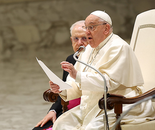 Pope Francis speaks to visitors in the Paul VI audience hall during his general audience at the Vatican Jan. 15, 2025.