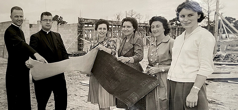 In this 1961 photo, at the construction site of Monsignor Edward Pace High School in Miami Gardens, from left, Fr. Luis Roberts, principal of the school; Msgr. William McKeever, superintendent of schools for the archdiocese; some members of the Teresian Institution; and far right, Rosemarie Kamke, former principal of Immaculata-La Salle School in Miami.