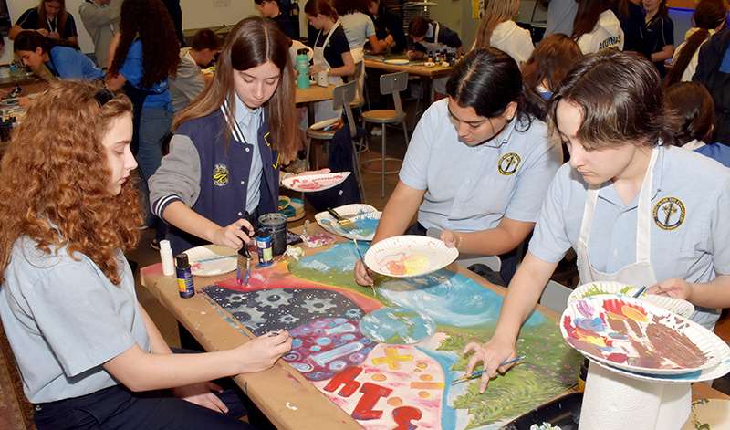 The team from St. Mark School in Southwest Ranches collaborates on spiritual-themed art Jan. 25, 2025, during Sister John Norton STEAMS Competition at St. Thomas Aquinas High School in Fort Lauderdale.