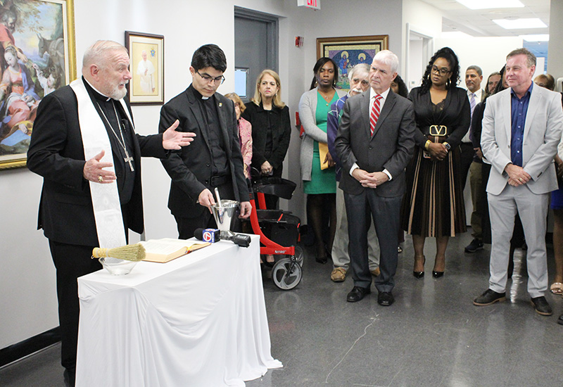 Archbishop Thomas Wenski speaks to guests and staff during the blessing ceremony of Catholic Legal Services' new Miami location on Jan. 15, 2025.