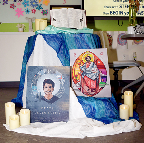 A small shrine honors the Blessed Carlo Acutis during Sister John Norton STEAMS Competition at St. Thomas Aquinas High School in Fort Lauderdale.