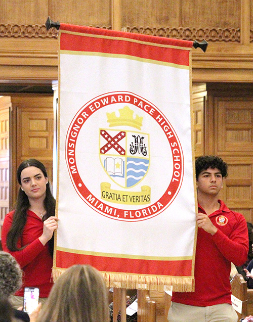 Students from Msgr. Edward Pace High School in Miami Gardens carry their school's banner before the start of the All Schools Mass for Catholic Schools Week at St. Mary Cathedral in Miami. Students and faculty from the 65 schools in the Archdiocese of Miami participated in the celebration Jan. 29, 2025.