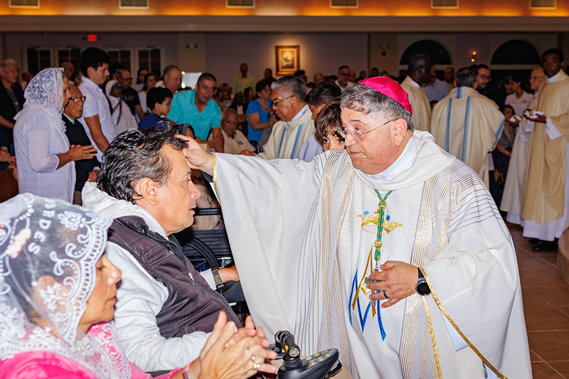 Miami Auxiliary Bishop Enrique Delgado administers the anointing of the sick during the Healing Mass at Our Lady of Lourdes Parish in Miami Feb. 11, 2025, the feast day of Our Lady of Lourdes and World Day of the Sick.