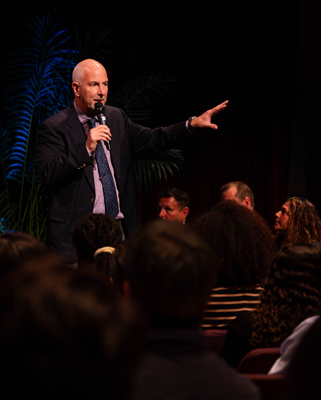 Donald Meyers, regional manager for Cambridge School deployment, outlines the advantages of earning a Cambridge diploma to parents and students of St. Thomas Aquinas High.