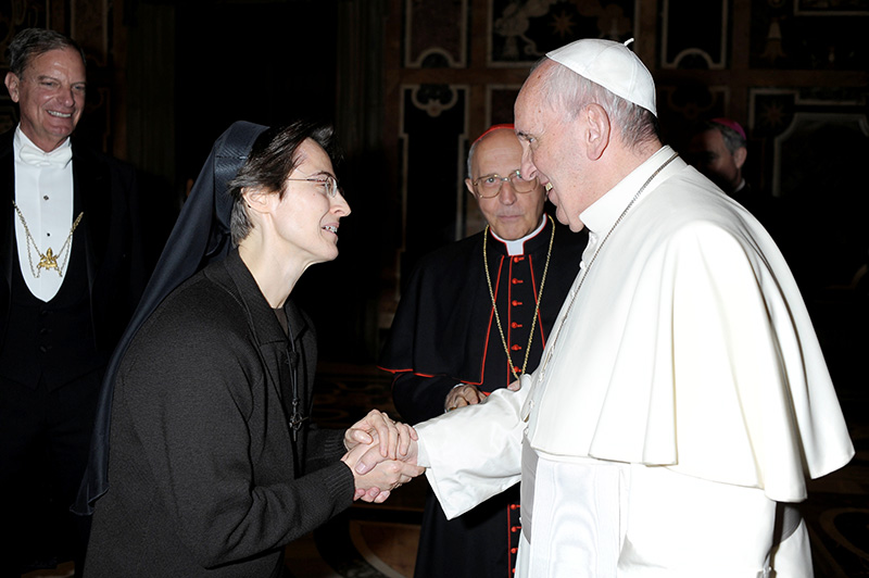 Pope Francis greets Sister Raffaella Petrini, an Italian member of the U.S.-based Franciscan Sisters of the Eucharist, at the Vatican Dec. 3, 2015. The Vatican announced Feb. 15, 2025, that Pope Francis has named Sister Petrini to be president of the office governing Vatican City State.