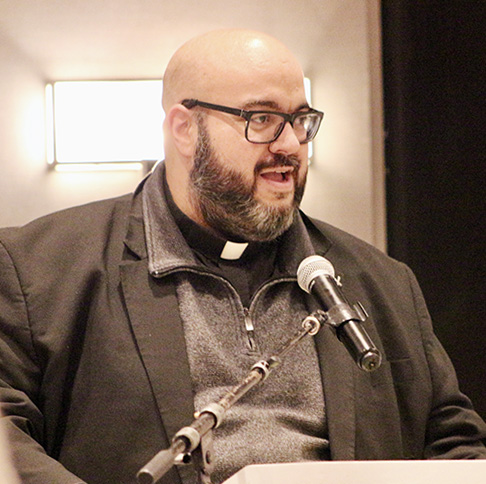 Father Matthew Gomez, dean of propaedeutic at St. John Vianney College Seminary in Miami, prays before the banquet dinner Jan. 25 at the 2025 Serra USA Rally for promoting vocations. The rally took place Jan. 23-25 at the Miami Marriott Dadeland.