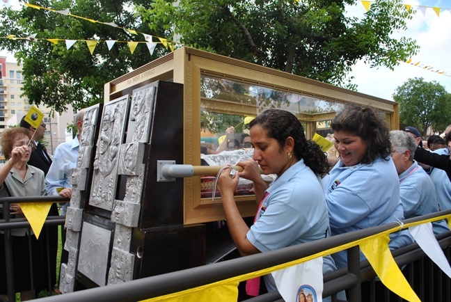 Salesian Cooperators help bring the relics of St. John Bosco onto the grounds of St. John Bosco Parish in Miami.