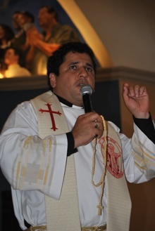 Father Juan Carlos Paguaga, pastor of St. John Bosco Church, leads a rosary in preparation for the arrival of the saint's relics.