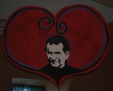 Heart-shaped decorations featuring St. John Bosco's words and image hang from the ceiling of St. John Bosco Church.