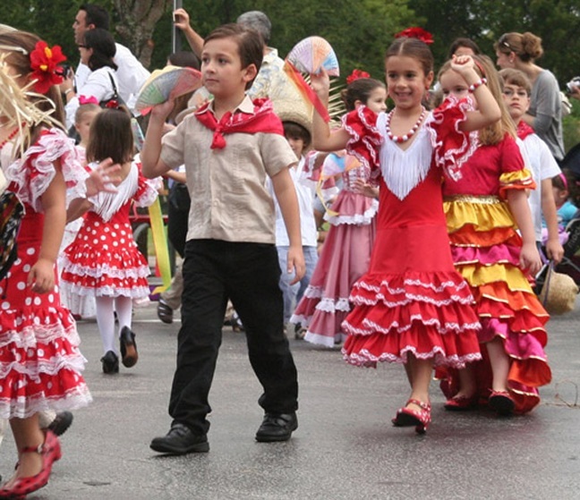 St. Theresa School's pre-kindergarten and kindergarten students - above and below, left - parade around the school grounds in costumes representing the various Hispanic cultures present at the school.