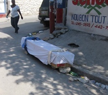 A coffin lies by the side of one of Port-au-Prince's streets after the Jan. 12 earthquake that, at the last estimate, is said to have killed 230,000 people.