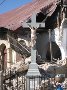 A crucifix is the only thing left unscathed in the ruins of Sacre Coeur Parish in Haiti.