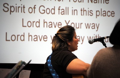 Natasha Perez of Our Lady of Lourdes Parish's music ministry, helps lead the worship during the annual Catholic Charismatic Conference which drew about 500 participants to Our Lady of Lourdes Parish in Miami Feb. 19-21.