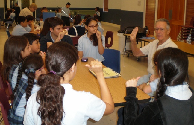 Students from Mother of Our Redeemer Catholic School in Miami learn sign language during the Schott Center's presentation of Welcome to My World during Catholic Schools Week.