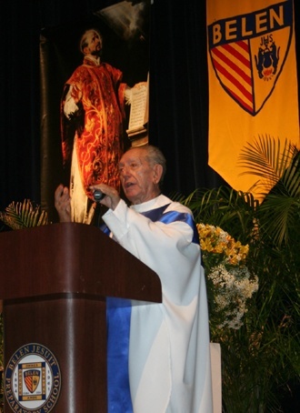 Jesuit Father Amando Llorente,the longtime spiritual director of the Agrupacion Catolica Universitaria, is shown here speaking during a Mass at Belen Jesuit Prep in Miami.