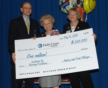 Dr. Patrick Taylor, Holy Cross President and CEO, Audrey Millsaps, and Holy Cross Senior Vice President & Chief Nursing Officer Nora Triola pose with Millsaps' donation.