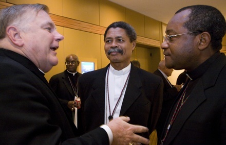 Miami Archbishop Thomas Wenski shares a funny story with two Haitian colleagues, Bishop Joseph Gontrand Dcoste of Jrmie, center, and Bishop Launay Saturn of Jacmel.