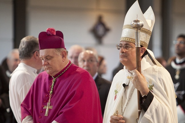 Archbishop Thomas Wenski and Bishop Gregory Mansour of the Eparchy of St. Maron of Brooklyn, which covers Maronite Catholics in South Florida, stand at the altar of Epiphany Church at the beginning of the funeral Mass for Anthony Abraham, local businessman and philanthropist who died at age 100 on Oct. 21.