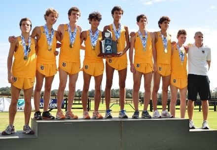 Belen Jesuit cross country runners pose on the winners' stand.