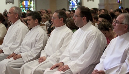 Before their ordination, the men listen to Archbishop Thomas Wenski's homily. From left: George Labelle, Guillermo Dutra, Ernesto del Riego, Carlos Charur and Jose Aleman.