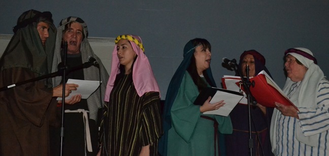 Escoger members sing Christmas carols during the living Nativity.