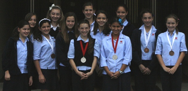 This group of sixth and seventh grade students represented St. John Neumann School at the South Florida Science and Engineering Regional competition which was held at Miami Dade College North Campus.  The following students were awarded with medals for their projects: Pictured, from left: Ciara Eckardt (bronze), Daniella DeeWitt (bronze), Sophia Fernandez (bronze), Sofia Fernandez (bronze), Alexandra Peterson (bronze), Melissa Navarro (silver), Gabriella Rose (bronze), Gabriella Socarras (bronze), Lucy Jones (silver), Danielle de Souza (bronze), Sophia Hernandez (bronze), and Taylor Scott (bronze).